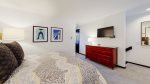 Loft style bedroom with 1 King bed, flat screen and attached bathroom